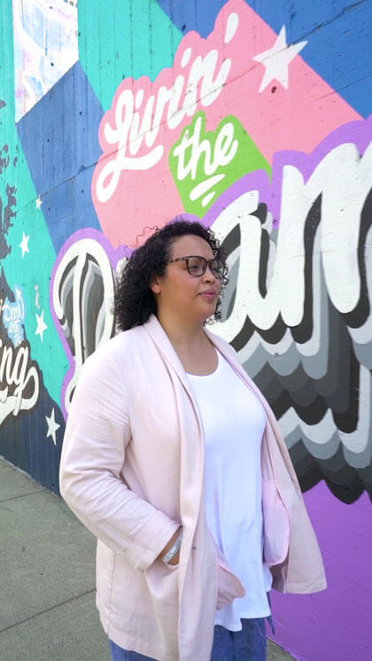 Berta Rivera walking down a street.