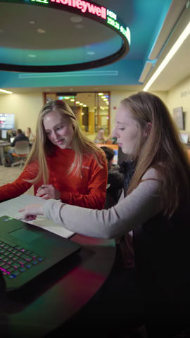 Kate Ferguson talking with another student.